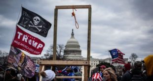 Gallows erected in front of the United States Capitol Building, alongside a Trump flag