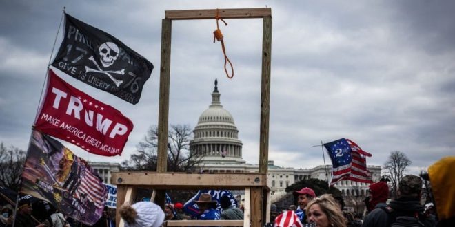 Gallows erected in front of the United States Capitol Building, alongside a Trump flag